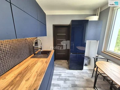 Kitchen; kitchen appliances, wood floor, tile floor, natural light