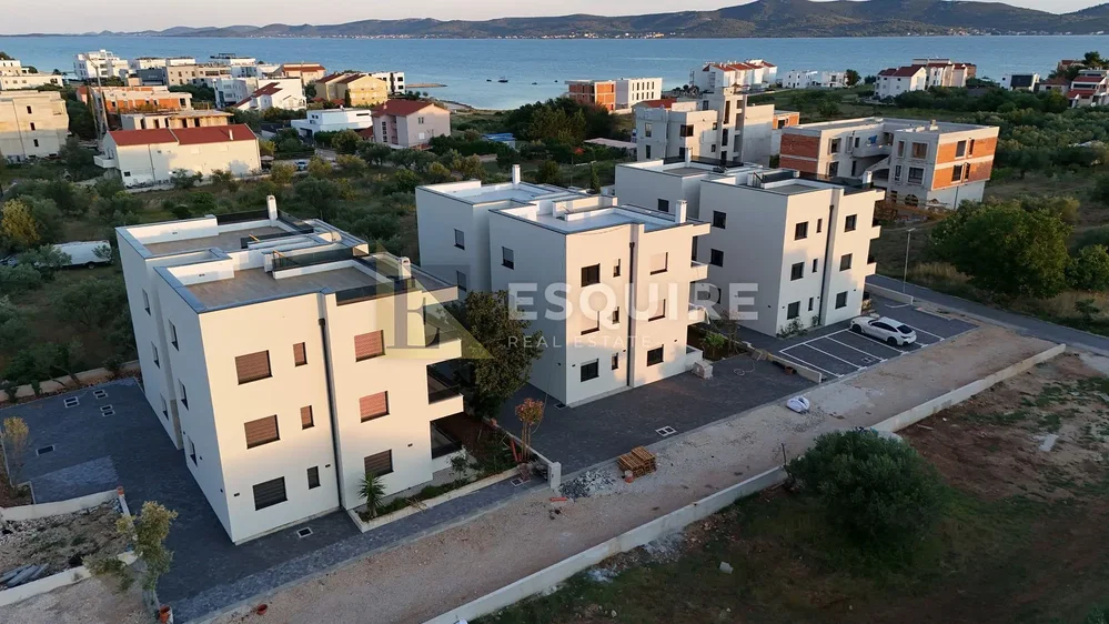 House and surroundings; view