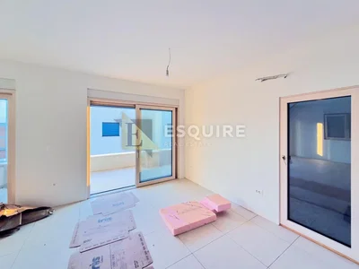 Living room; tile floor, natural light, needs renovation