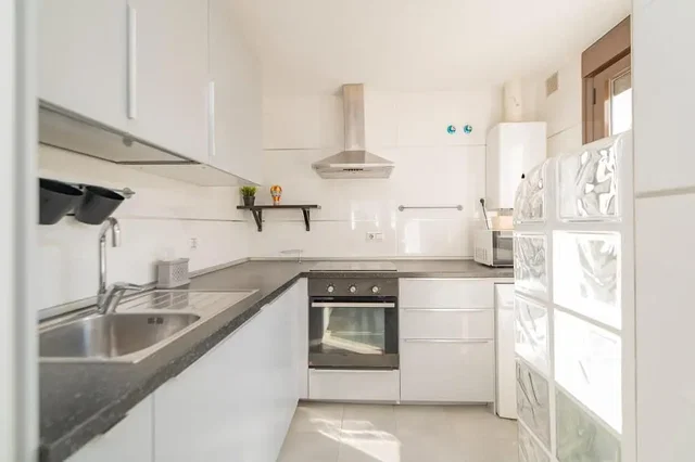 Kitchen; kitchen appliances, natural light, renovated, tile floor