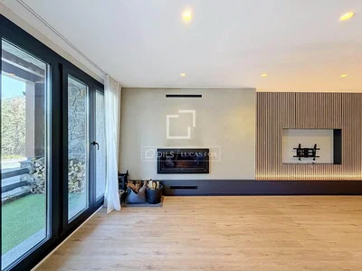 Living room; wood floor, fireplace, natural light