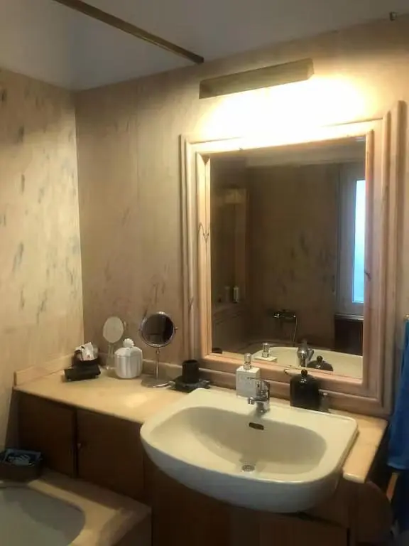 Bathroom; tile floor, wood beams, renovated, natural light