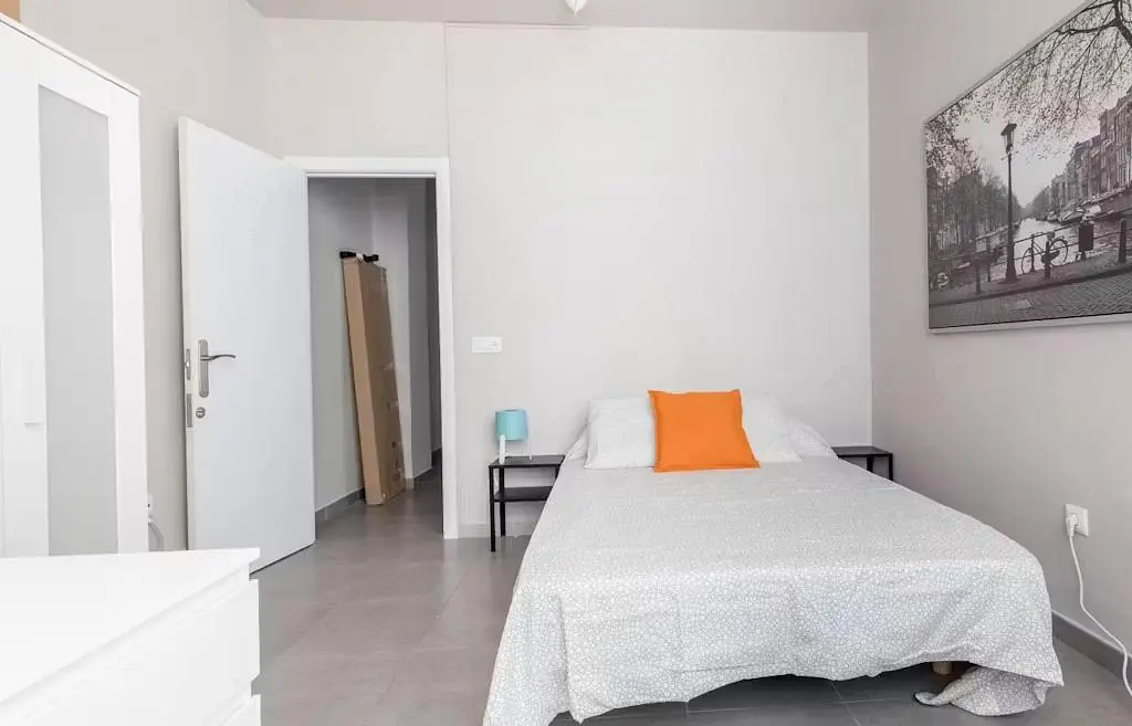 Bedroom; tile floor, natural light
