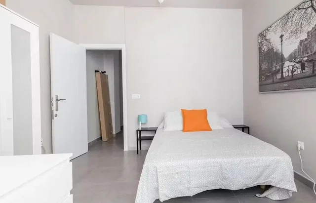 Bedroom; tile floor, natural light