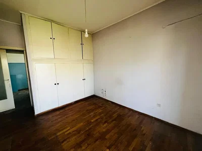 Bedroom; wood floor, needs renovation, natural light