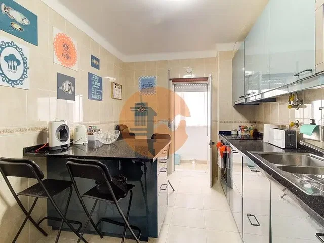 Kitchen; kitchen appliances, tile floor, needs renovation