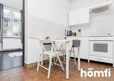 Kitchen; tile floor, kitchen appliances, natural light