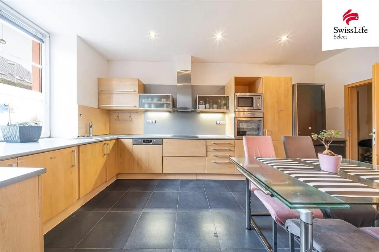 Kitchen; kitchen appliances, tile floor, natural light