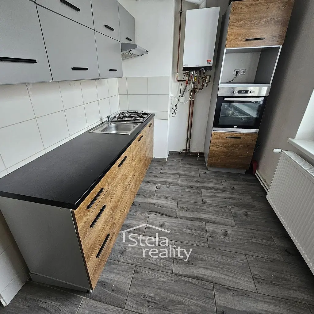 Kitchen; kitchen appliances, wood floor, tile floor