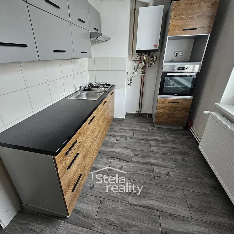 Kitchen; kitchen appliances, wood floor, tile floor