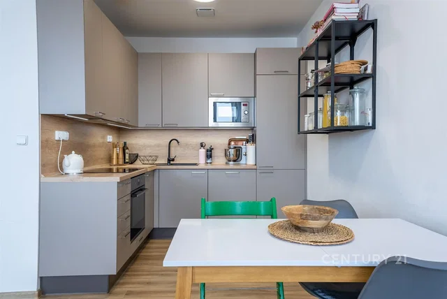Kitchen; kitchen appliances, wood floor, natural light, modern style