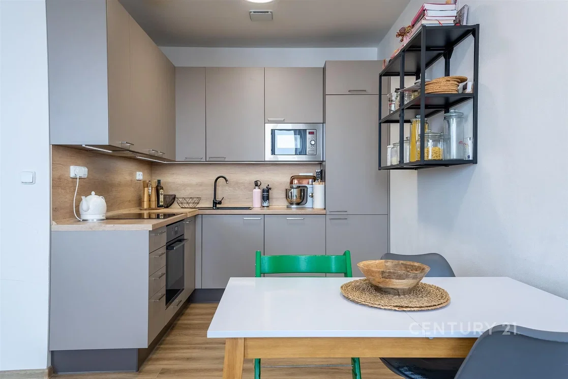 Kitchen; kitchen appliances, wood floor, natural light, modern style