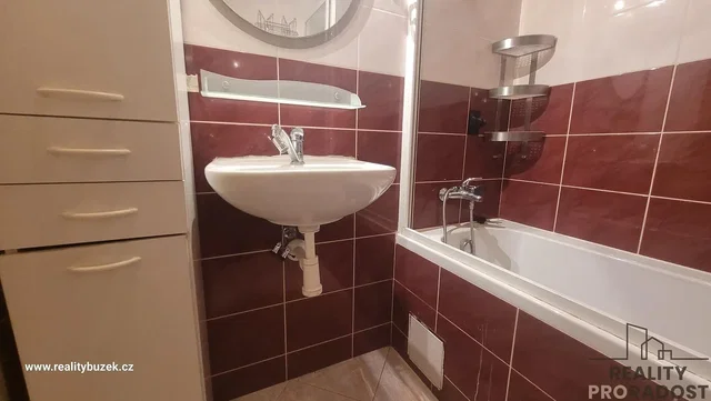 Toilet; tile floor, needs renovation