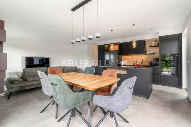 Living room; tile floor, kitchen appliances, natural light, modern style