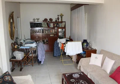 Living room; tile floor, needs renovation, natural light