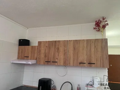 Kitchen; kitchen appliances, tile floor, needs renovation