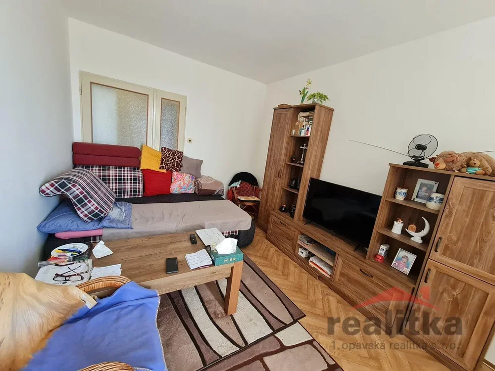 Living room; wood floor, natural light, needs renovation