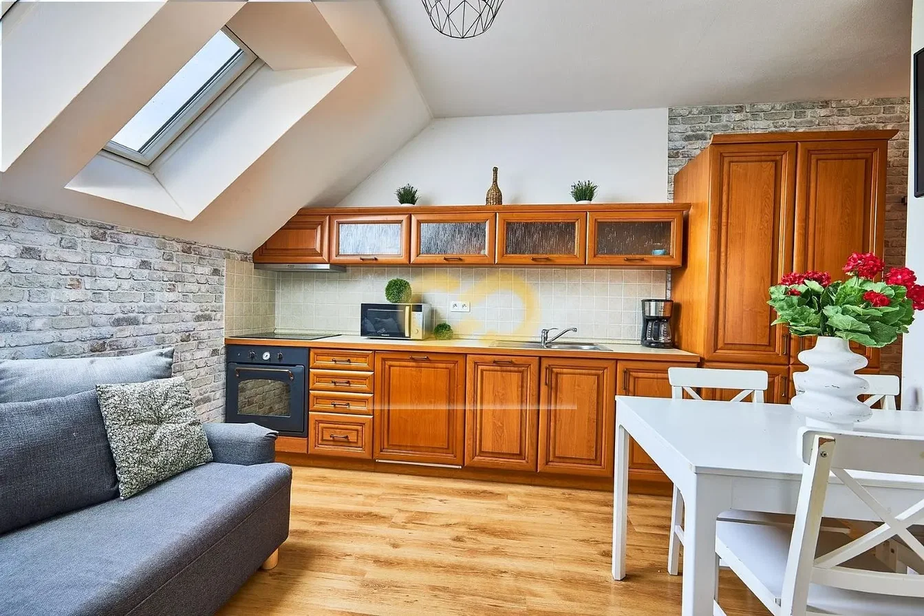 Kitchen; kitchen appliances, wood floor, natural light