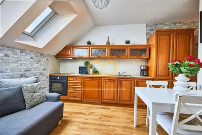 Kitchen; kitchen appliances, wood floor, natural light