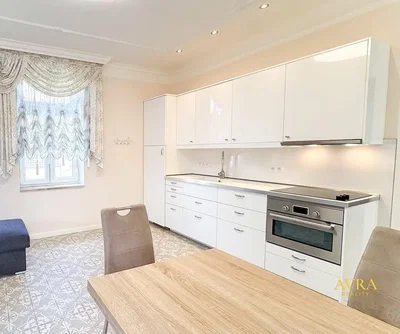 Kitchen; kitchen appliances, wood floor, tile floor, renovated, natural light