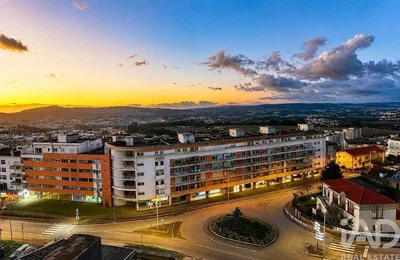 House and surroundings; view