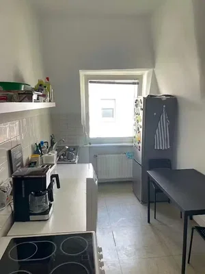 Kitchen; kitchen appliances, tile floor, natural light