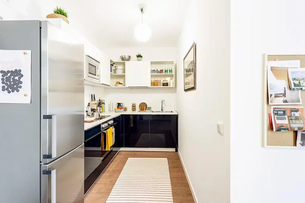 Kitchen; kitchen appliances, wood floor, natural light
