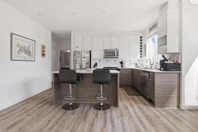 Kitchen; kitchen appliances, wood floor, natural light