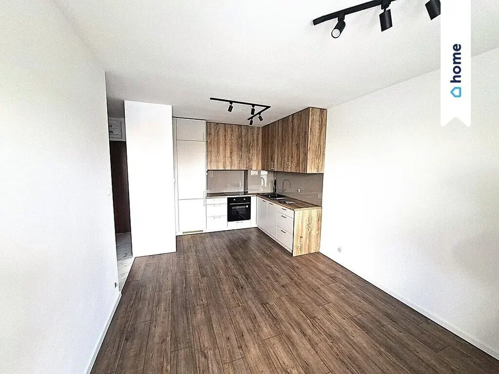 Kitchen; kitchen appliances, wood floor, natural light, renovated