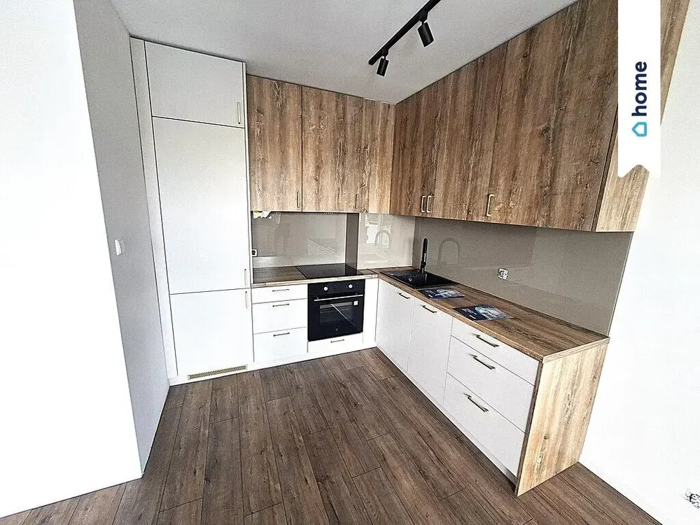 Kitchen; kitchen appliances, wood floor, renovated, natural light