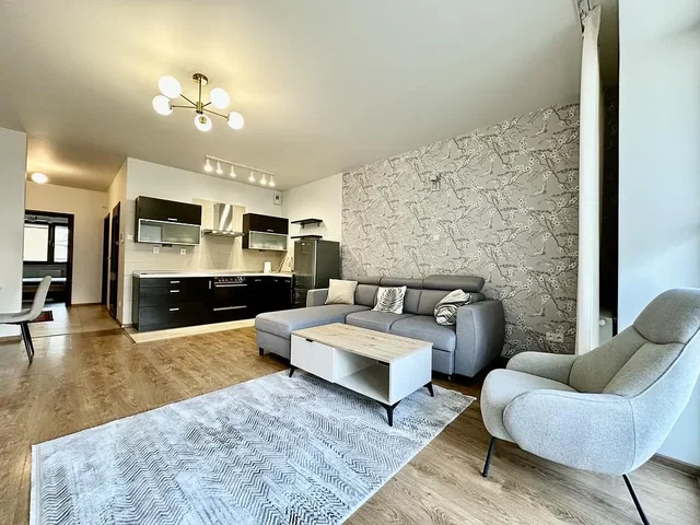 Living room; wood floor, natural light, modern style, kitchen appliances