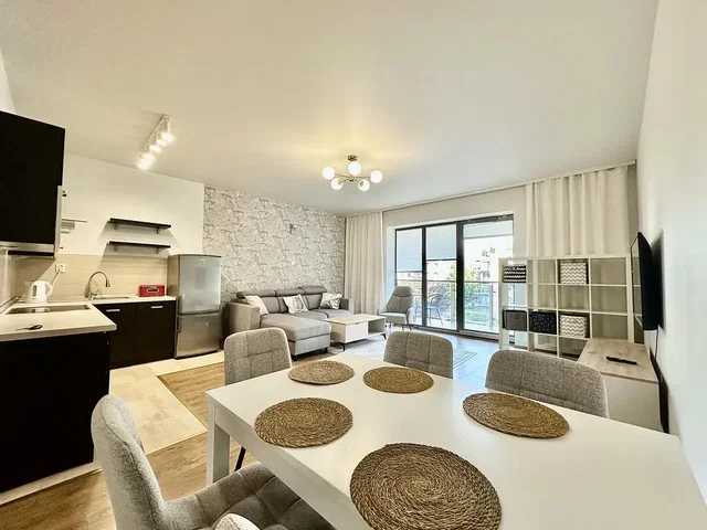 Living room; natural light, modern style, wood floor, kitchen appliances