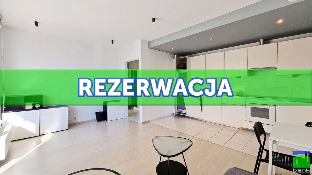 Living room; kitchen appliances, natural light, tile floor