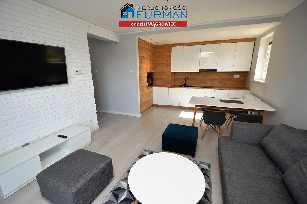 Living room; kitchen appliances, natural light, modern style, wood floor