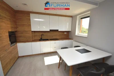 Kitchen; kitchen appliances, wood floor, natural light, modern style