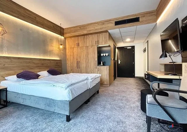 Bedroom; wood beams, modern style, renovated, natural light, wood floor