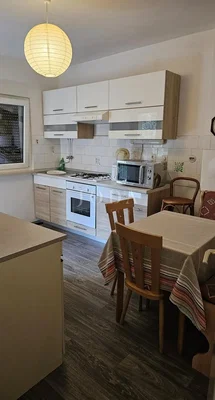 Kitchen; kitchen appliances, tile floor, natural light