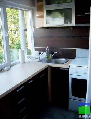 Kitchen; kitchen appliances, natural light, tile floor