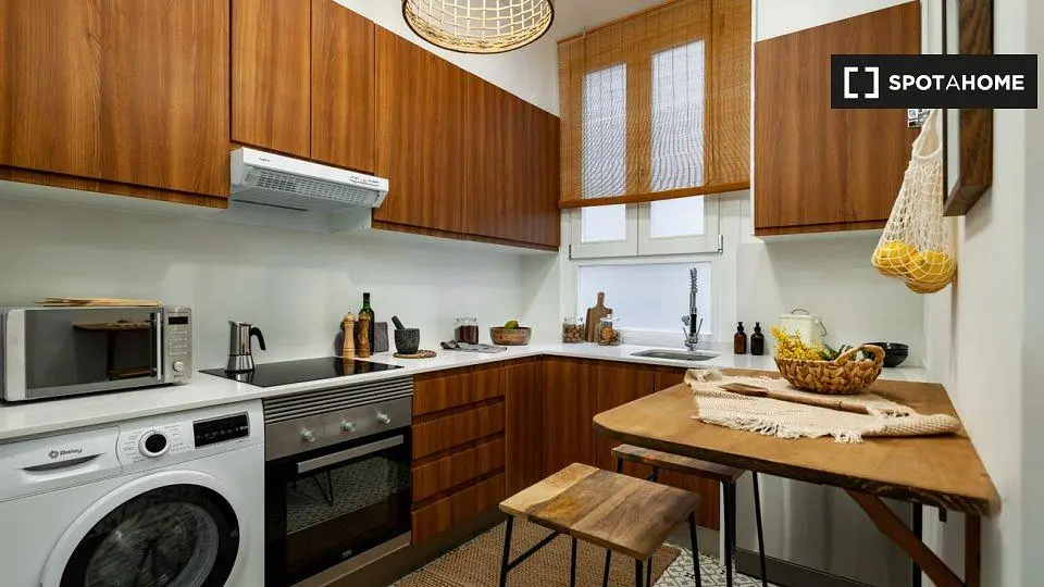 Kitchen; kitchen appliances, wood floor, natural light