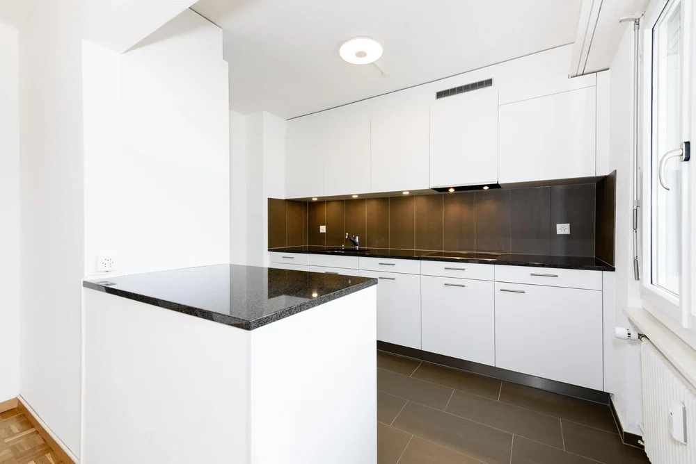 Kitchen; kitchen appliances, tile floor, natural light