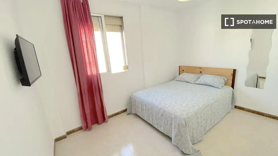 Bedroom; natural light, tile floor