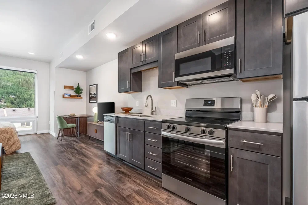 Kitchen; kitchen appliances, natural light, modern style, wood floor