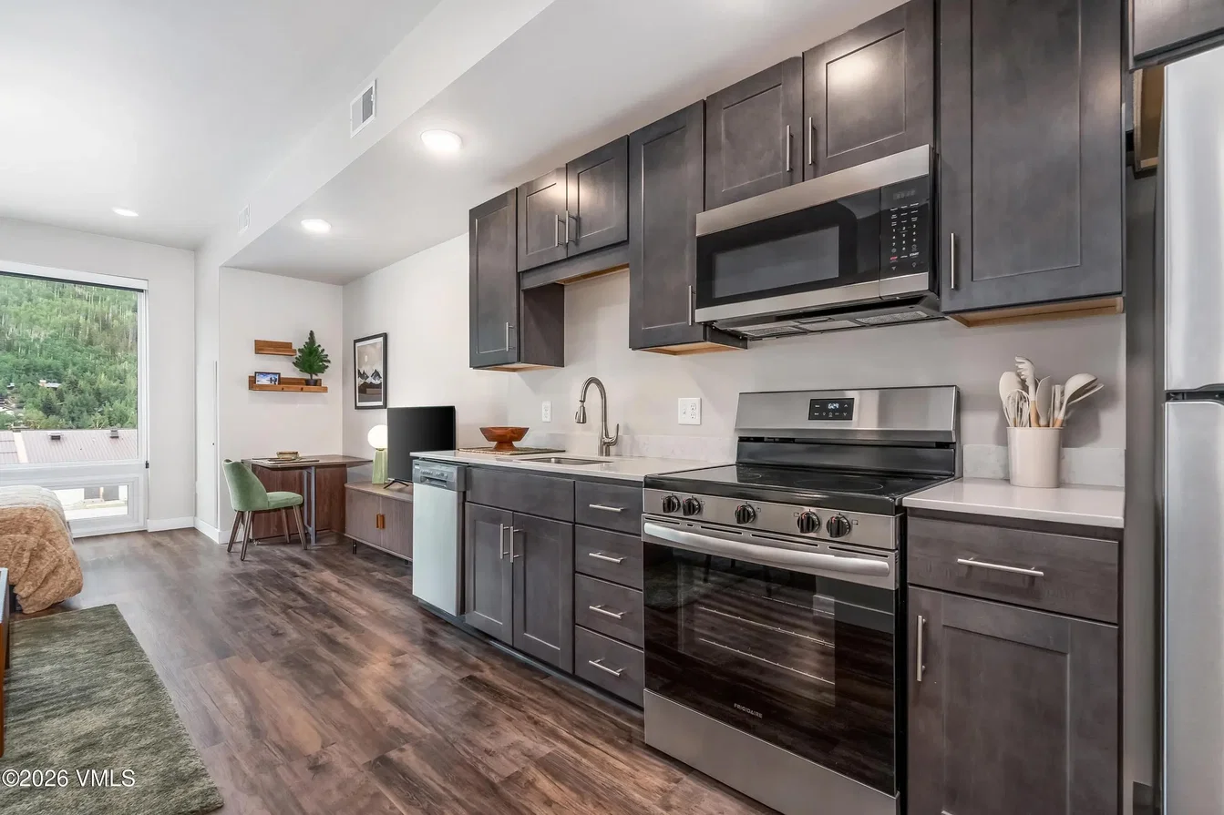 Kitchen; kitchen appliances, natural light, modern style, wood floor