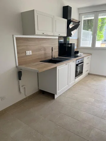 Kitchen; kitchen appliances, tile floor, natural light, renovated