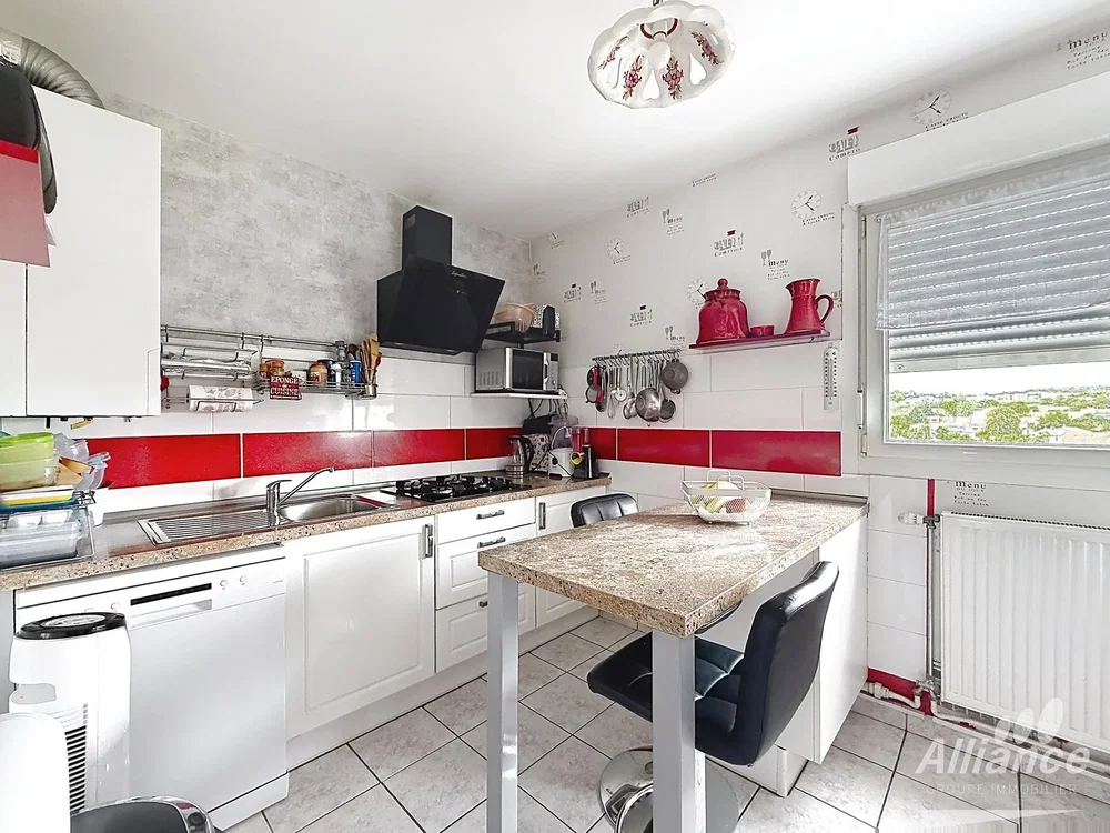 Kitchen; kitchen appliances, tile floor, natural light