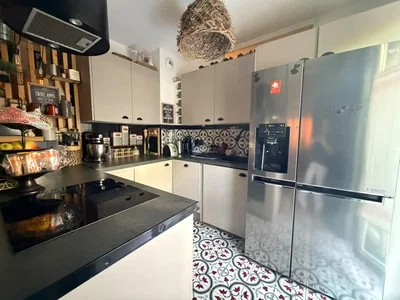 Kitchen; kitchen appliances, tile floor, natural light