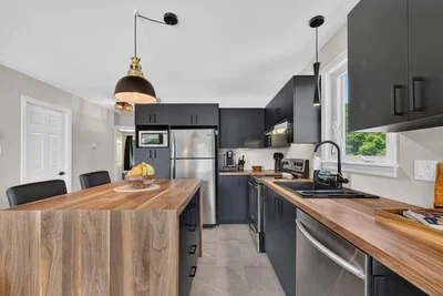 Kitchen; kitchen appliances, wood floor, renovated, natural light