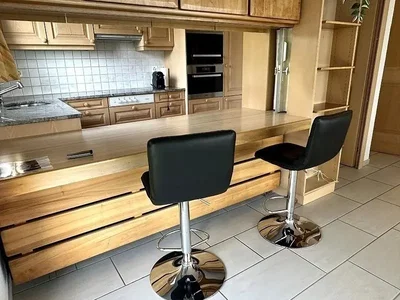 Kitchen; kitchen appliances, tile floor, natural light