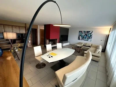 Living room; natural light, wood floor, tile floor, modern style