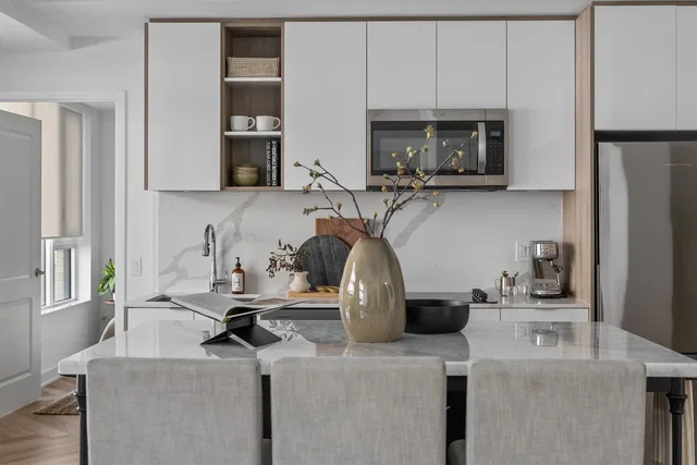 Kitchen; kitchen appliances, wood floor, natural light, modern style, renovated